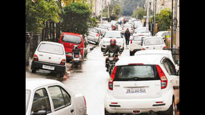 Finance secretary halts parking policy, says talk to residents