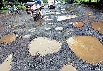 Humour: BBMP requests pedestrians and motorists to help cover potholes by falling into them