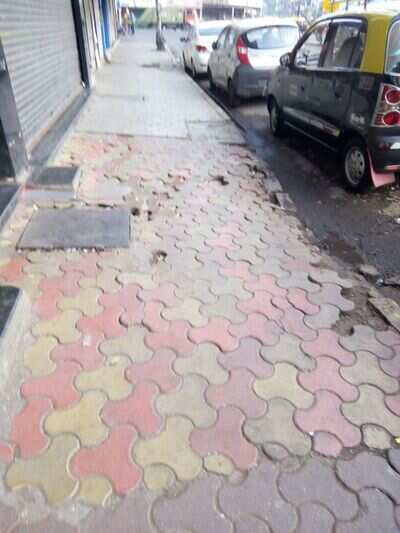 foot path in very bad conditions - Times of India