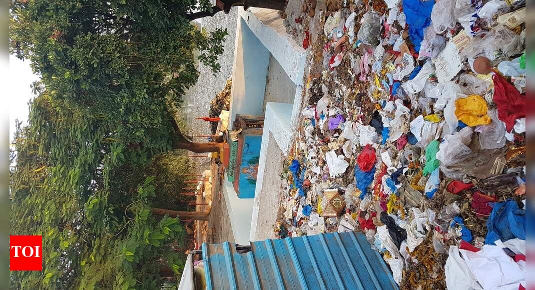 Temple amidst garbage at necklace road - Times of India