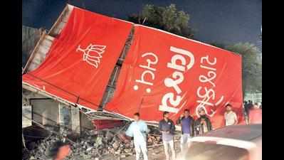 BJP hoardings collapse, three vehicles damaged