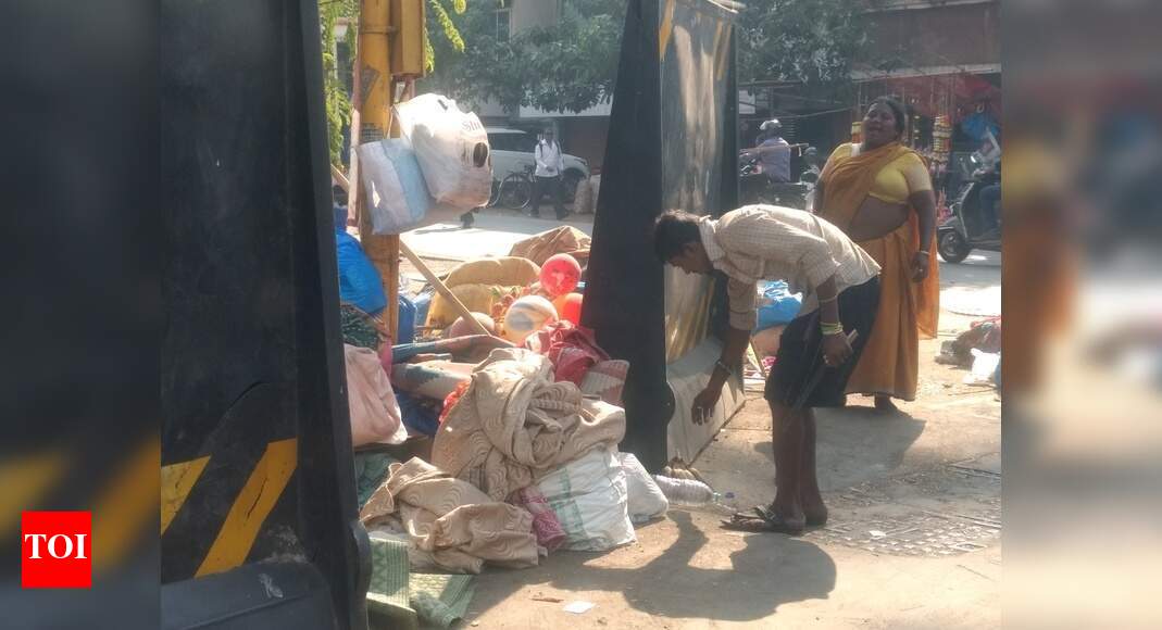 Encroached footpath turns home - Times of India