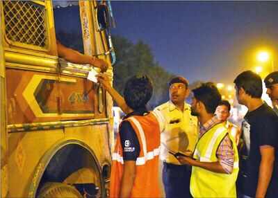 Image result for lady constable in highway stopping lorries in india