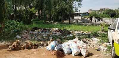 Pond turned into Garbage VAT - Times of India