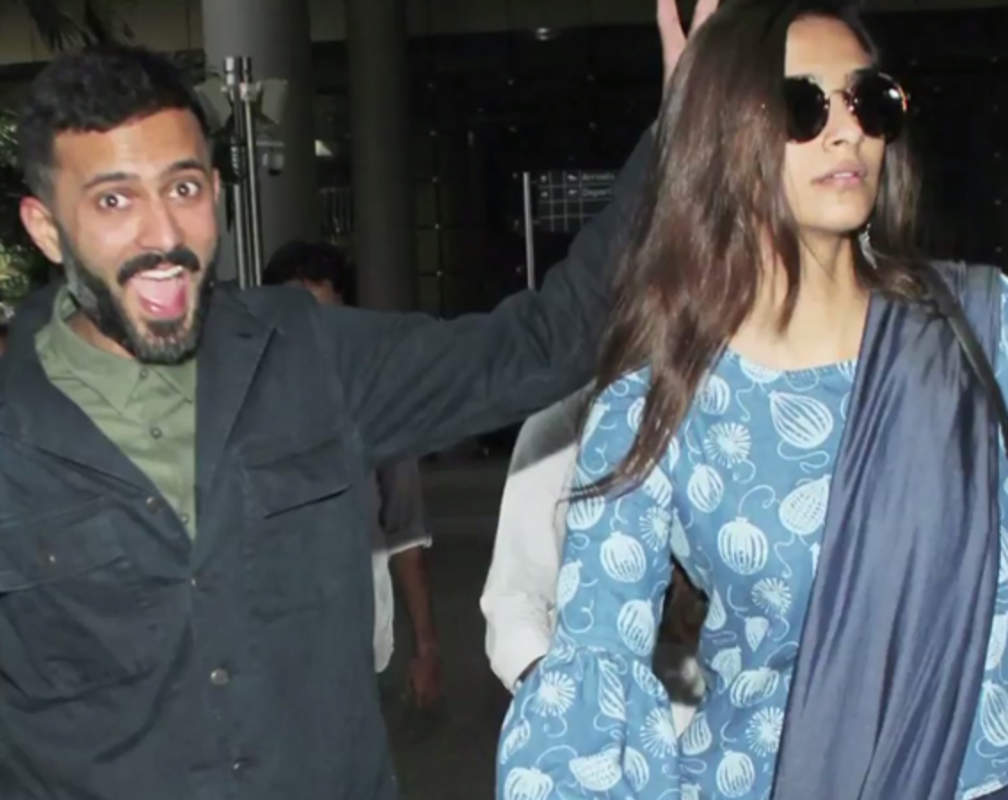 
Anand Ahuja gets goofy at the airport with Sonam Kapoor
