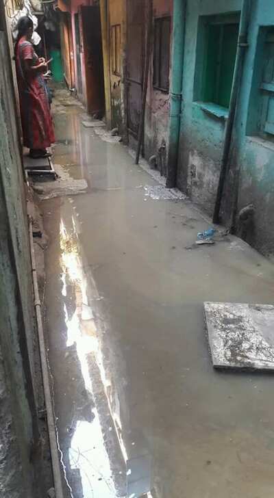 slums filled with gutter water - Times of India