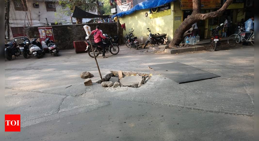 badly damaged road which can cause a major acciden - Times of India