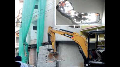 Under-construction building tilts; BBMP begins demolition