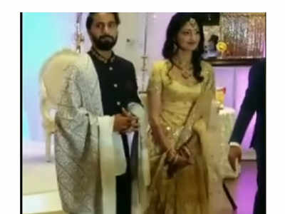 Divya Unni looks her best at her wedding reception, wearing a golden-coloured lehenga
