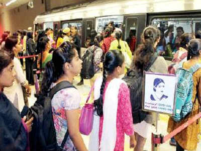 Women cheer, throng reserved Metro doors