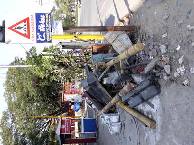 Abandoned traffic signal materials on footpath..