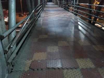 Tiles came out on Goregaon Highway Footover bridge