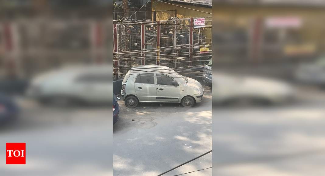 Abandoned car takes up space - Times of India