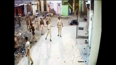Cops throwing stones caught on CCTV camera