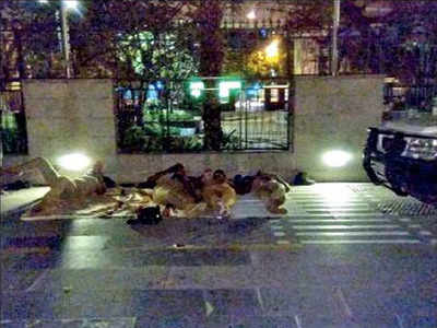 No respite for police on guard duty, many sleep on pavement