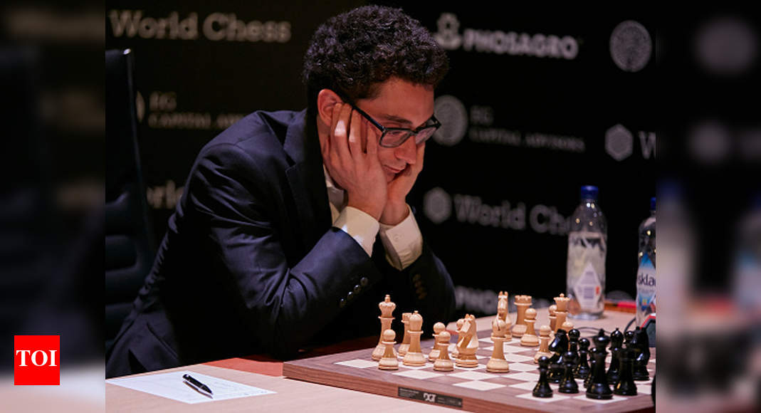 22 March 2018, Germany, Berlin: Italian-American chess champion Fabiano  Caruana competes against Shakhriyar Mamedyarov (not shown), a chess  champion from Azerbaijan, at this year's FIDE World Chess Candidates  Tournament at the Kuehlhaus