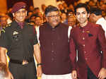 Mahendra Singh Dhoni poses with Ravi Shankar Prasad and Pankaj Advani
