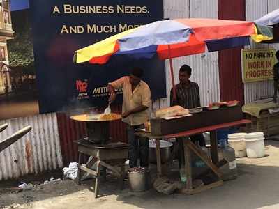 Open flame cooking by illegal vendors on the Road