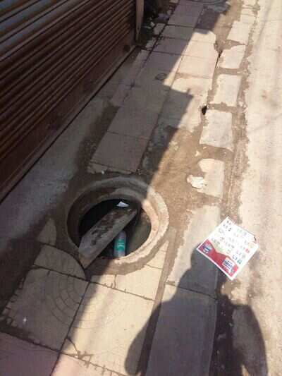 OPEN POTHOLE - Times of India