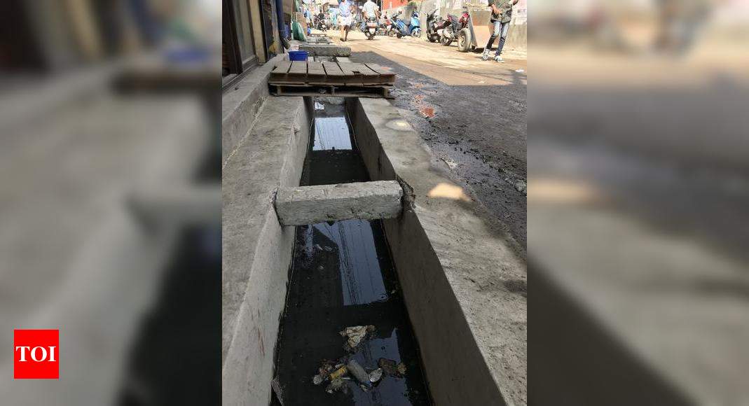 Open Sewers near market junction - Times of India