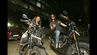 Women bikers’ evening out at a city restopub