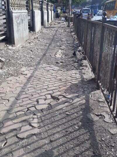 Sorry state of footpath - Times of India