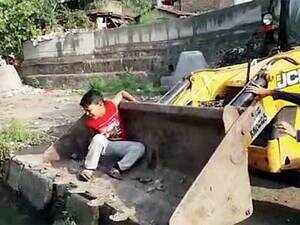 Scared boy in machine bucket, video goes viral