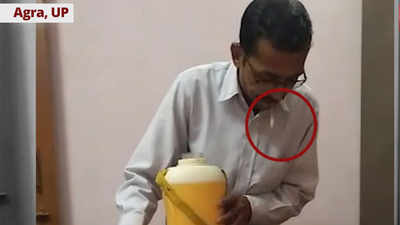 Caught on cam: Employee spits in boss’ glass of water