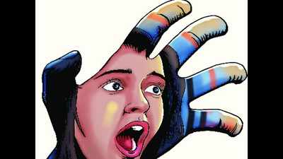 Professor booked as student alleges he molested her