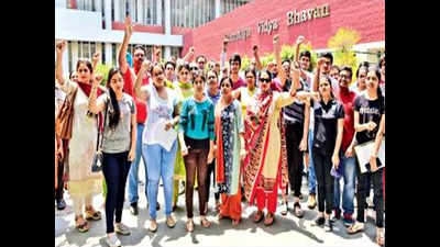 Class XII English scores slip, students & parents protest