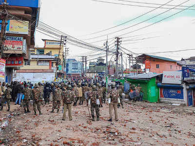 Army holds flag march in restive Shillong; cop injured in clash