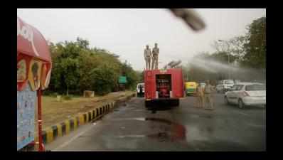 High pollution forces Noida to sprinkle water on roads