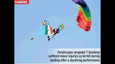 Windy affair: Paratrooper has a scary landing, hurt