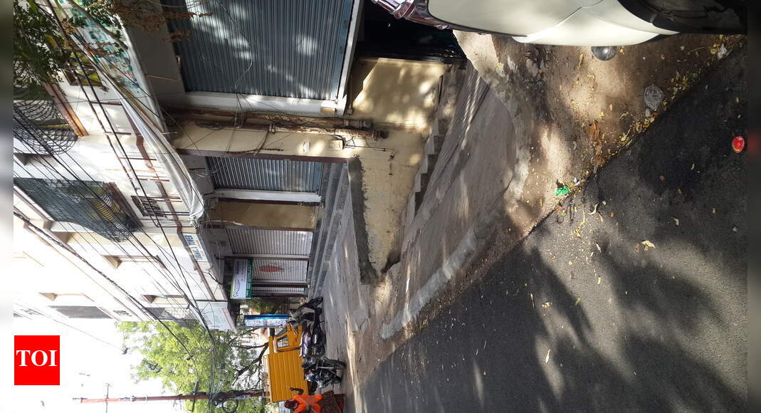 Cellar ramp encroaching public road - Times of India
