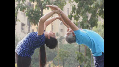 Siblings, father-daughter and BFFs bond over #PartnerYoga in Noida