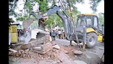 Non-cooperative cops stall razing of Bharat Nagar temple