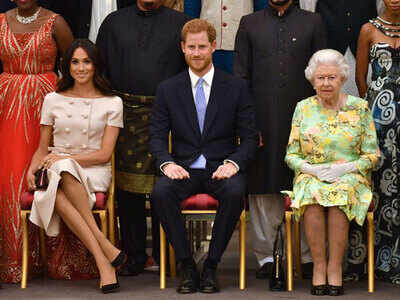 Meghan Markle slammed for crossing her legs and showing disrespect to the  Queen - Times of India