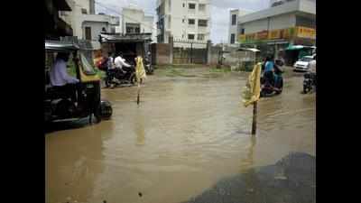 To alert motorists, residents erect poles in waterlogged potholes