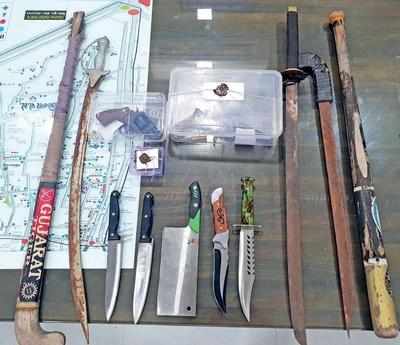 Two held with weapons from Bapunagar slums | Rajkot News - Times of India