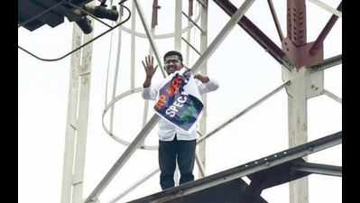 Man climbs atop tower for special status to Andhra Pradesh