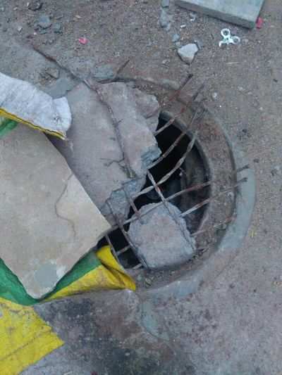 Uncovered and Damaged Manhole.