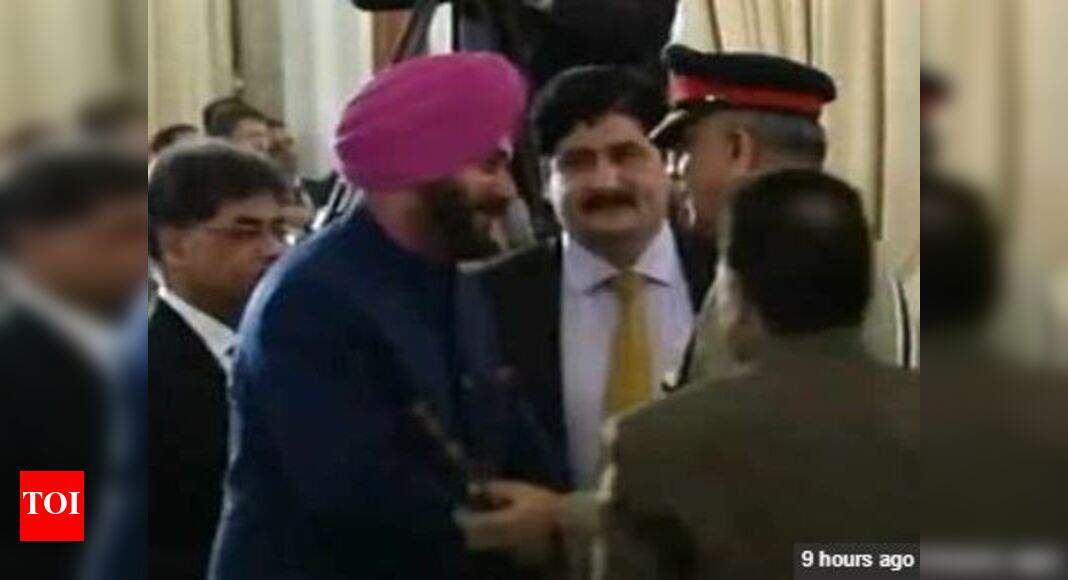Navjot Singh Sidhu: Seated next to PoK 'president', Sidhu hugs Pakistan army chief, sparks row