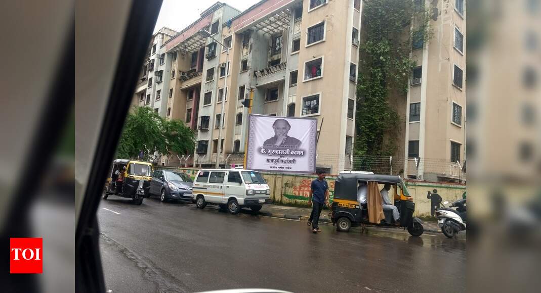 footpath occupied by hoarding - Times of India