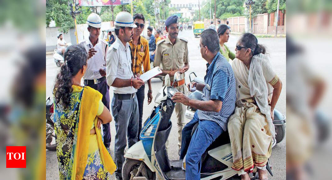 Wear helmets or face action Cops Rajkot News Times of India
