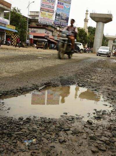 Image result for potholes filled in 13 days after NMC