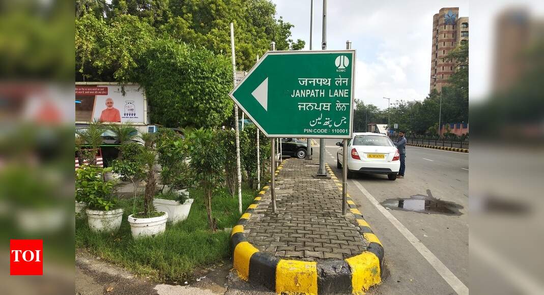 Hoarding on footpath - Times of India