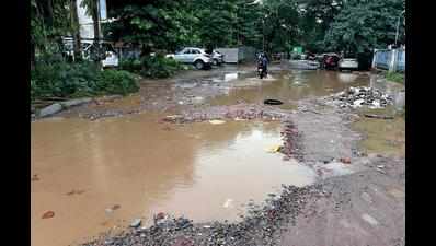 Never repaired, potholes turn into craters, road disappears