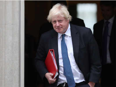 Boris Johnson assaults May's Brexit plan at fractious party meeting