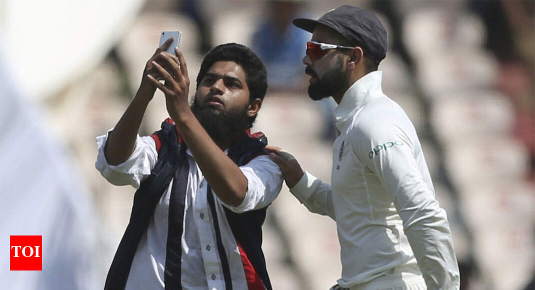 India vs West Indies: Another fan breaks security cordon for selfie with Virat Kohli - Times of India
