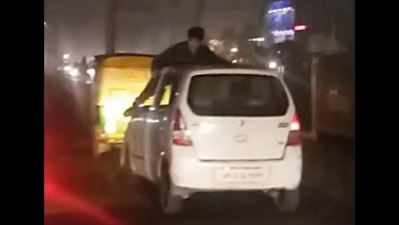 After quarrel on road, man dragged on bonnet of car